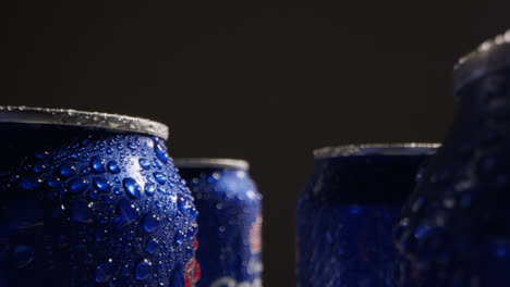 Close-Up-Or-Macro-Shot-Of-Condensation-Droplets-On-Takeaway-Cans-Of-Cold-Beer-Or-Soft-Drinks-Against-Black-Background-1